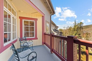 Private balcony with outdoor seating and pool views!