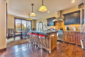 Main level gourmet kitchen with Viking appliances and 4 bar seats