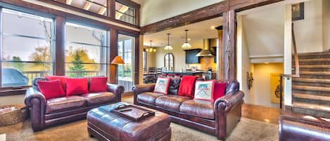 Main level living room with gas fireplace, 55" TV, and cozy seating