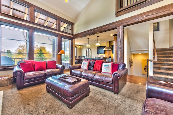 Main level living room with gas fireplace, 55" TV, and cozy seating