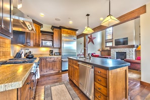 gourmet kitchen with Viking appliances and 4 bar seats