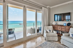 Living Room - Gorgeous views of the gulf from the living room with large smart TV.