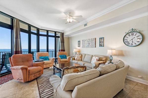 Spacious Living and Dining Areas with floor to ceiling windows reveal a perfect view of paradise.