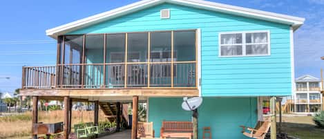 South side of West Beach Cottage - The south side of the cottage faces the Gulf of Mexico and is a short walking distance from sticking your toes in the sand. A screen porch is offered so you can enjoy outdoors without having to battle the elements.