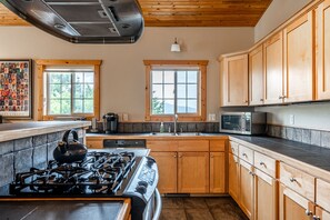 Full kitchen with Keurig coffee maker.