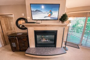 Relax in front of the gas fireplace on a snowy day