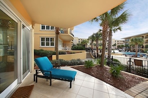 Corner condo next to D building - Spacious patio with chaise lounges overlooking the 8000 square foot pool.