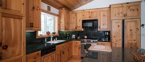 nicely done kitchen with granite countertops