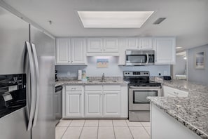 Updated Kitchen with Stainless Steel Appliances and Granite Counter Tops