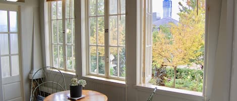 Entrance/Sunroom overlooks the front yard with skyline in the background.