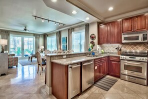 Custom Kitchen in Adagio G105 - Granite counter tops, garbage disposal, a wide array of cooking ware, glass ware, stand alone ice maker and a welcome gift from Your Friend at the Beach greet you when you arrive to Adagio G105!
