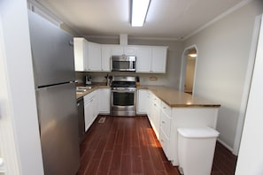 The spacious kitchen was remodeled in 2022 and includes new stainless steel appliances.