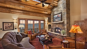 Great room with beautiful stone fireplace, south side