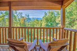 Rocky Top Lookout’s Two covered decks offer spectacular views of the Smoky Mountains