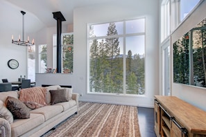 Large living room windows provide plenty of natural light