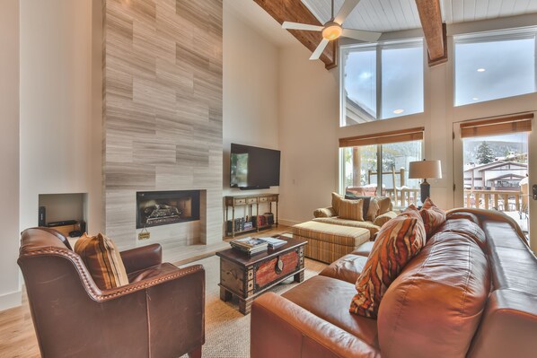 Penthouse Side A Living Room with a Gas Fireplace, a 70" Sony Smart TV, and Queen Sofa Sleeper