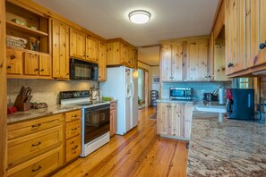 Kitchen with dishwasher and drip-style coffeemaker