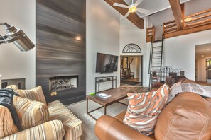 Living Room with Comfortable Furnishings and Access to Loft Bedroom