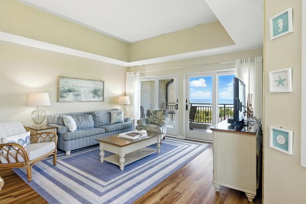 Living Room with Flat Screen TV and Private Balcony