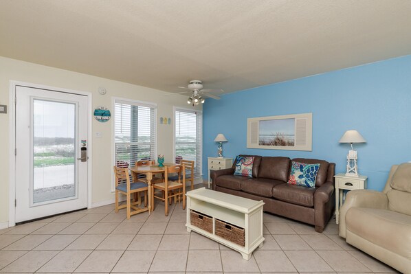 Living area with queen size sleeper sofa and cozy seating to enjoy family gatherings