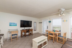 Entertainment center with flat-screen TV and plenty of seating