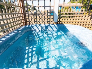 Relax in the 6-person hot tub on the main house covered deck