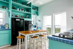 Cozy coastal kitchen with a breathtaking ocean view