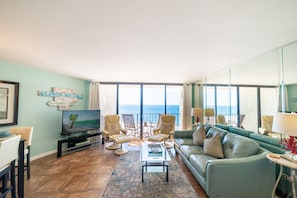 Enjoy breathtaking views from this beautifully decorated condo with soft leather furniture.