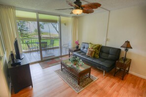 Easy Access - The living room provides quick and easy access to Menehune Shores 225’s balcony where you can sit and enjoy the cool breeze and share stories with a friend.