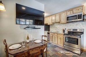 Dining Room/Kitchen - Beautiful dining table with flat screen T.V