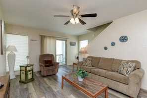 Living area with a beachfront view and queen size sleeper sofa