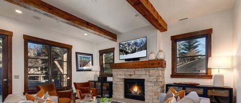 Lower Level Family Room with Cozy Seating, 55" Smart TV, Gas Fireplace and Deck & Hot Tub Access