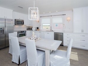 Dining Room Tab;e - The dining room table and kitchen.
