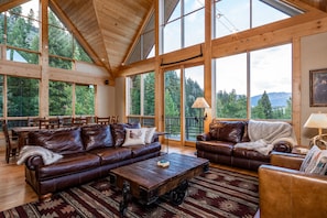 This is a true great room off the kitchen area with huge windows for amazing views of the forested hillsides, distant mountains and Beaver Creek below.