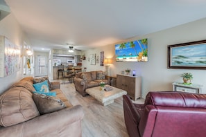 Inviting living area with seamlessly integrated kitchen, dining, and living areas, perfect for creating lasting memories