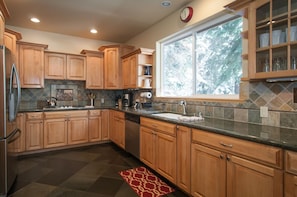 beautifully done large kitchen with granite counters, walk in pantry