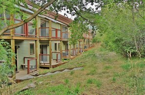 Park City Woodside Ski Estate - lower back deck with bistro table and chairs.  Quit'n Time ski run is adjacent to this deck.