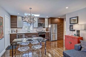 Glass dining table with acrylic chairs