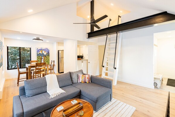 Living Room with Fireplace, Desk, Full-Size Sleeper Sofa, and Access to Loft