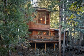 Spectacular rear view of deck and master bedroom from the creek - Spectacular rear view of deck and master bedroom from the creek in the back yard