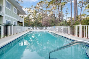 Outdoor Communal Pool - Laguna Breeze offers an outdoor, communal pool with loungers for enjoying a relaxing day in the sun.