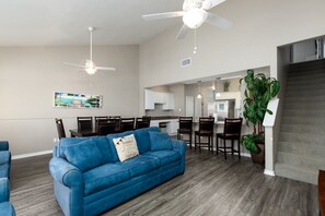 Inviting family hub with seamlessly integrated kitchen, dining, and living areas, perfect for creating lasting memories