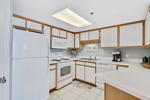 Full Size Kitchen with Stainless Steel Appliances and Breakfast Bar