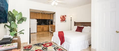 Queen Bedroom with Large Flat Screen TV and Ceiling Fan