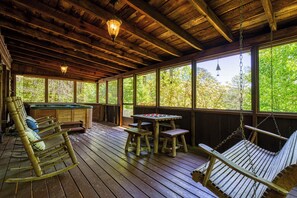 Spend some family time on the back porch enjoying the hot tub, playing checkers, or just overlooking the beautiful scenery around you.