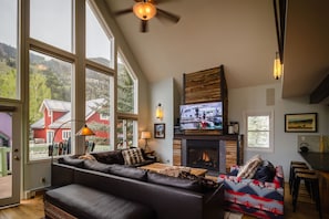 Living area with fireplace and TV