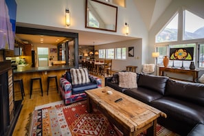 Living area with views into Kitchen and Dining area