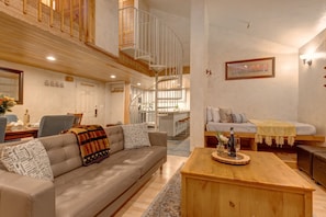 Living Room with cContemporary leather furnishings, a wood-burning fireplace, Smart TV with cable, and built-in, cozy reading nook