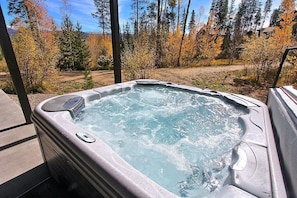 Relax in the private hot tub off the lower level patio