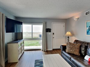 Living Room with TV and Patio Access